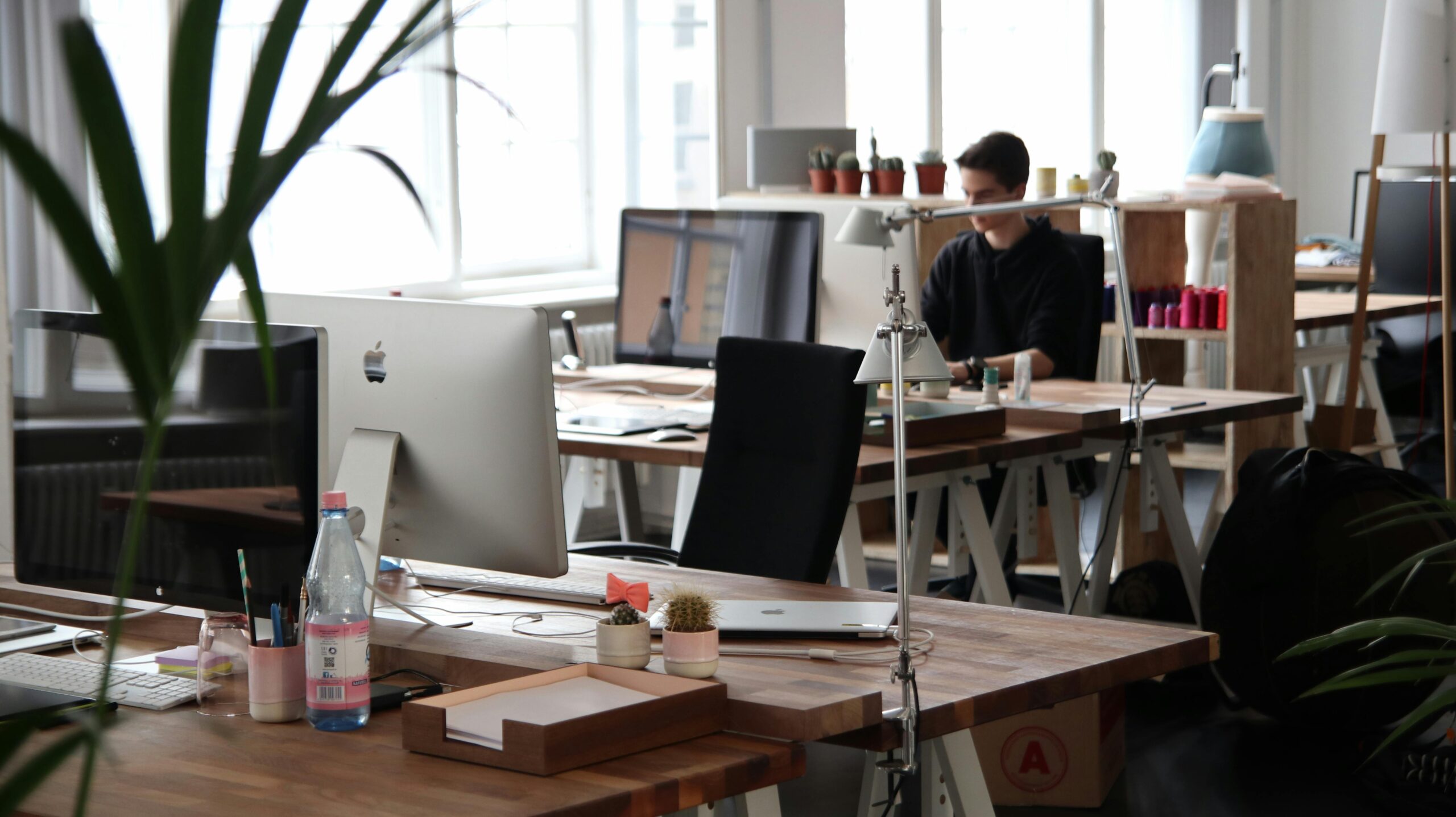 pexels-photo-380769-380769-1 Open-plan office with modern decor and natural lighting, ideal for productivity.